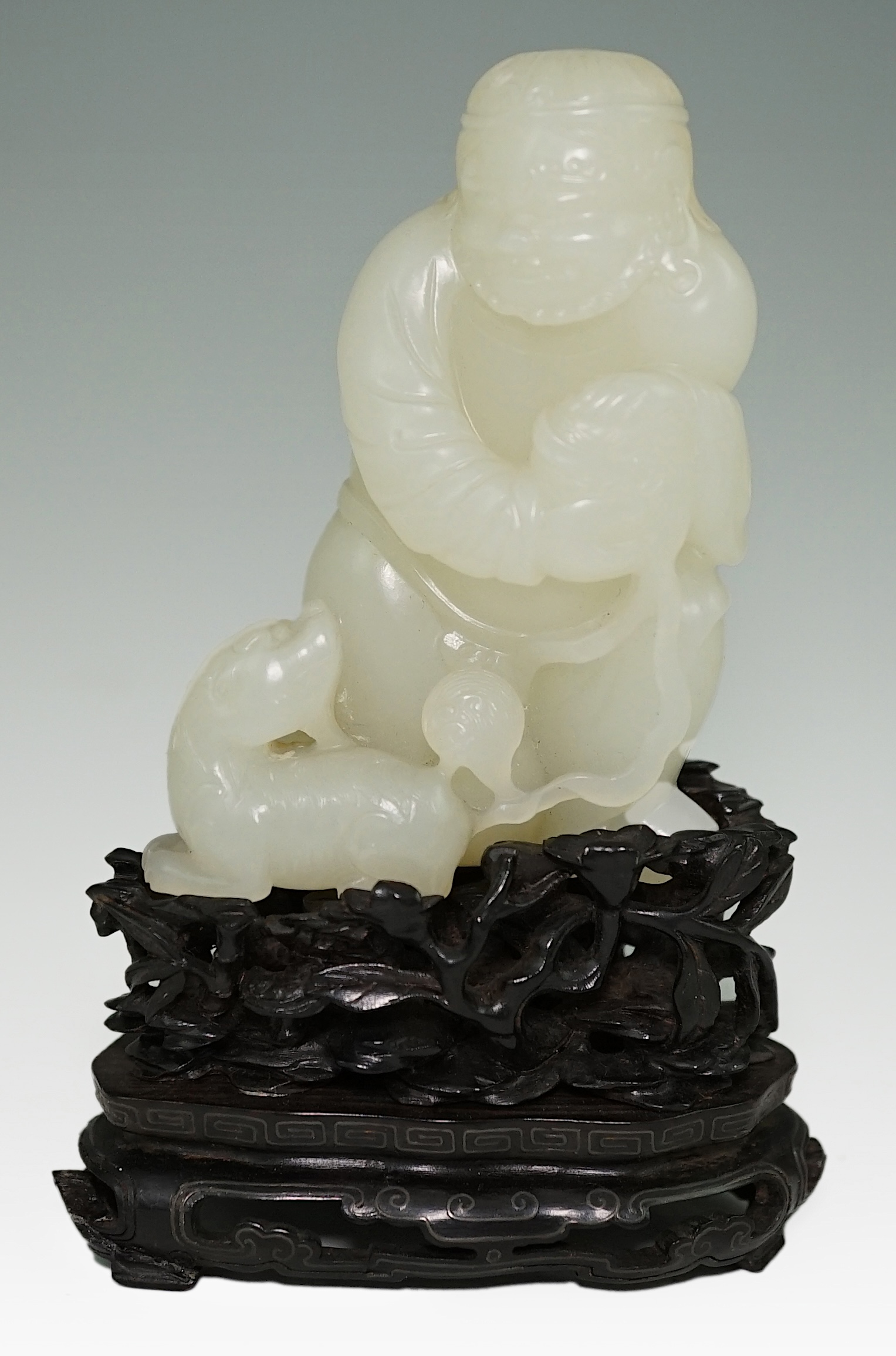 A fine Chinese white jade group of a bearded foreigner, 18th century